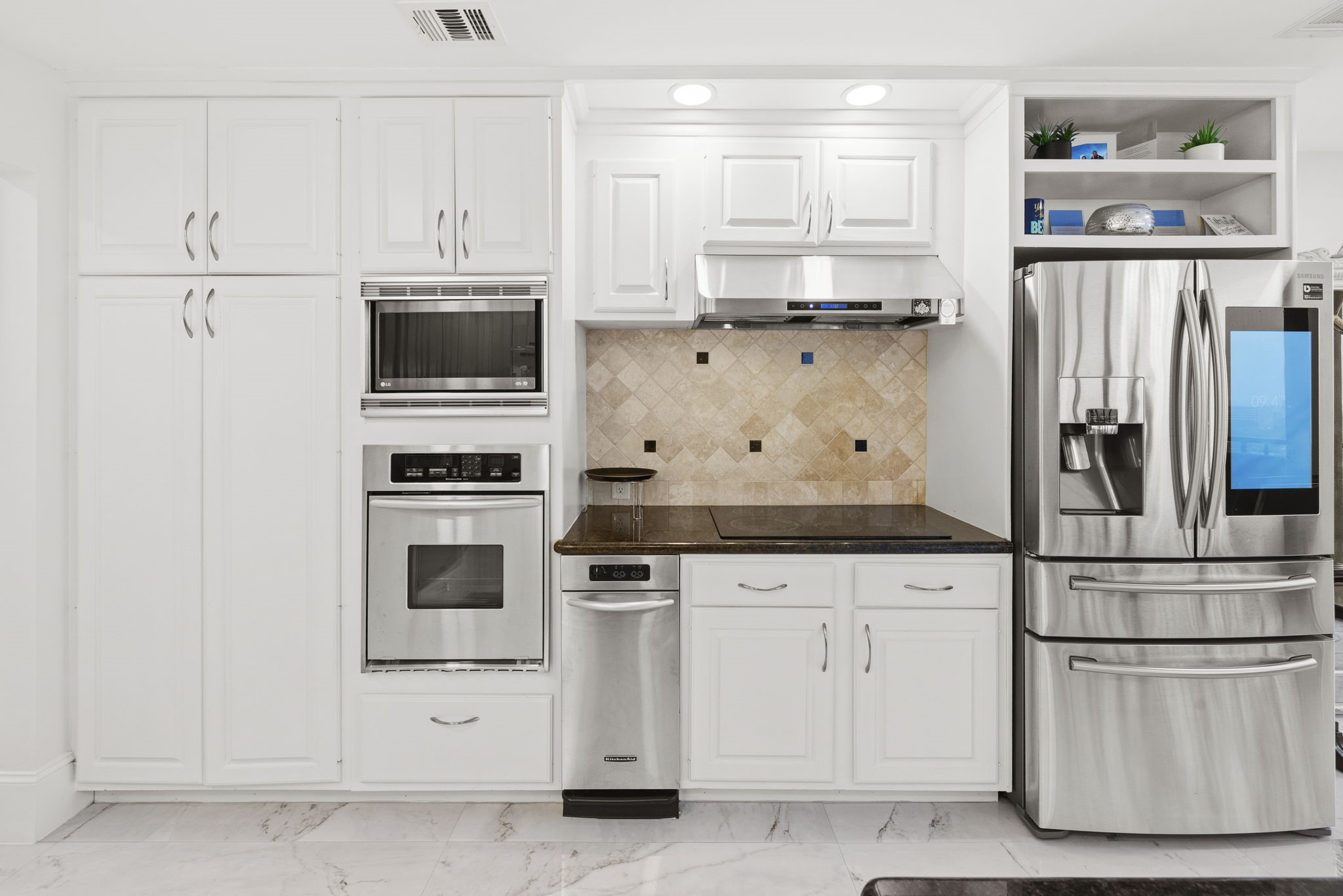 3350 McCue Road, Unit 1901 Houston, TX 77056 - Photo 6 of 29 a kitchen with white cabinets and white appliances
