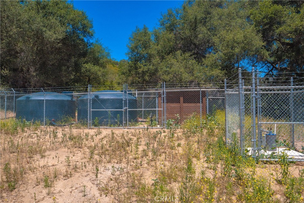 3738 Camaron Road Temecula, CA 92590 - Photo 24 of 40 New well water storage tanks and secured equiptment.