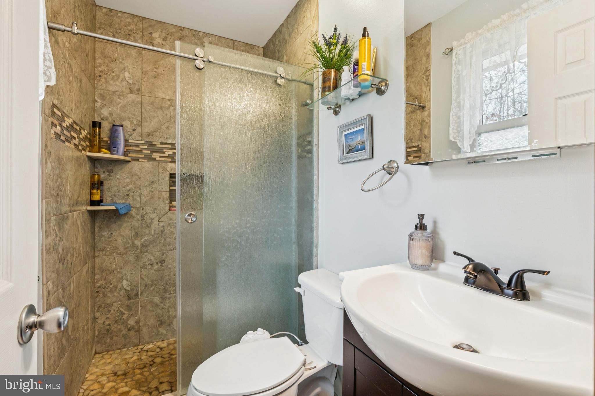 60 Spaulding Drive Monroeville, NJ 08343 - Photo 16 of 26 a bathroom with a sink toilet and shower