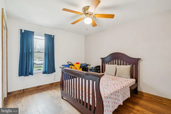 a bedroom with furniture and a window