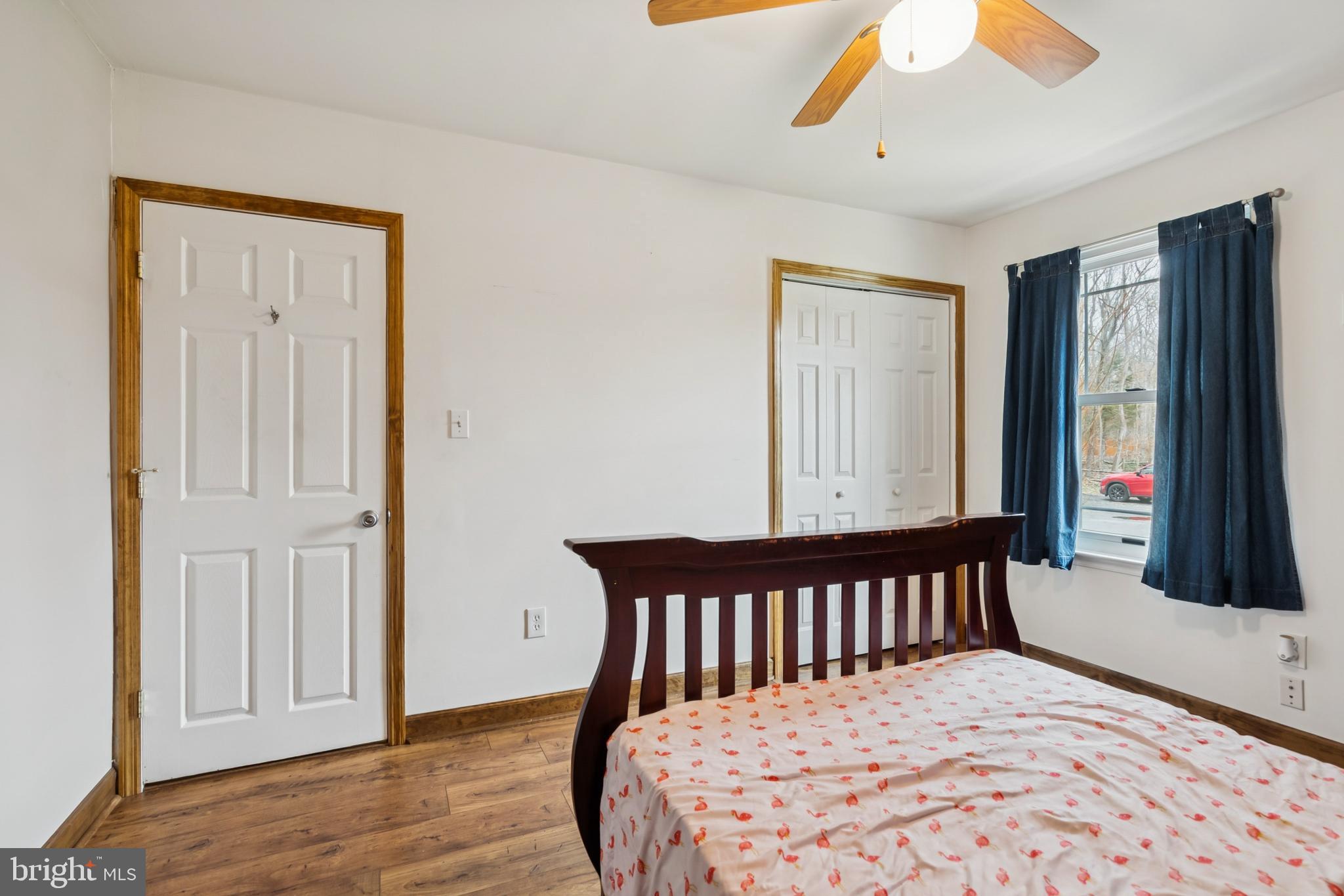 60 Spaulding Drive Monroeville, NJ 08343 - Photo 18 of 26 a bedroom with a bed and wooden floor