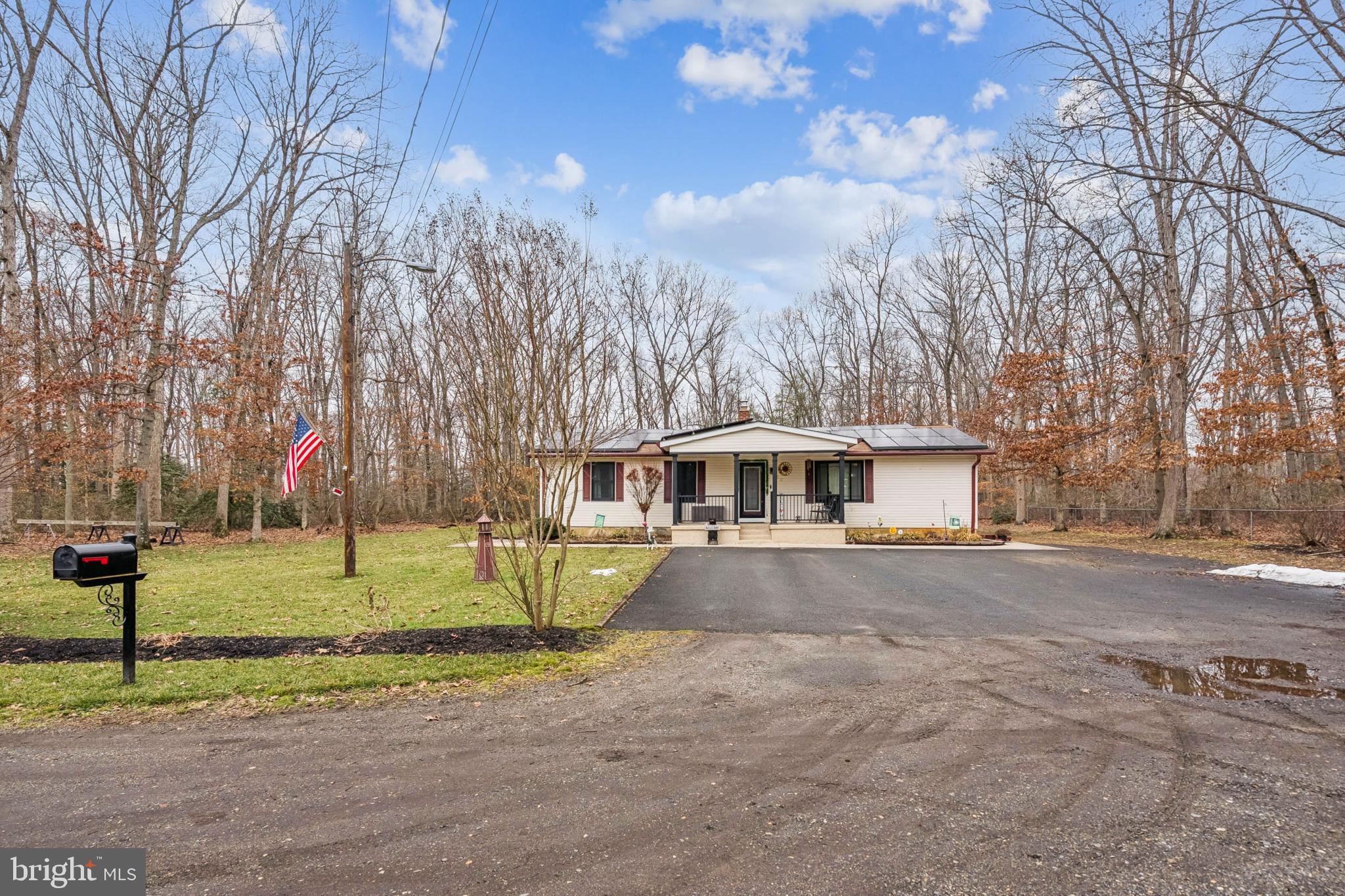 60 Spaulding Drive Monroeville, NJ 08343 - Photo 2 of 26 a view of a house with a yard covered in snow