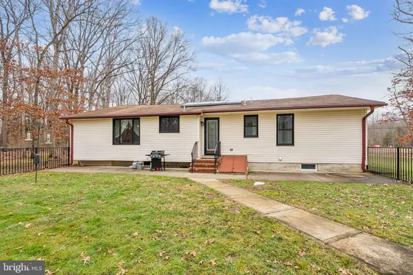a picture of a bathroom with a shower