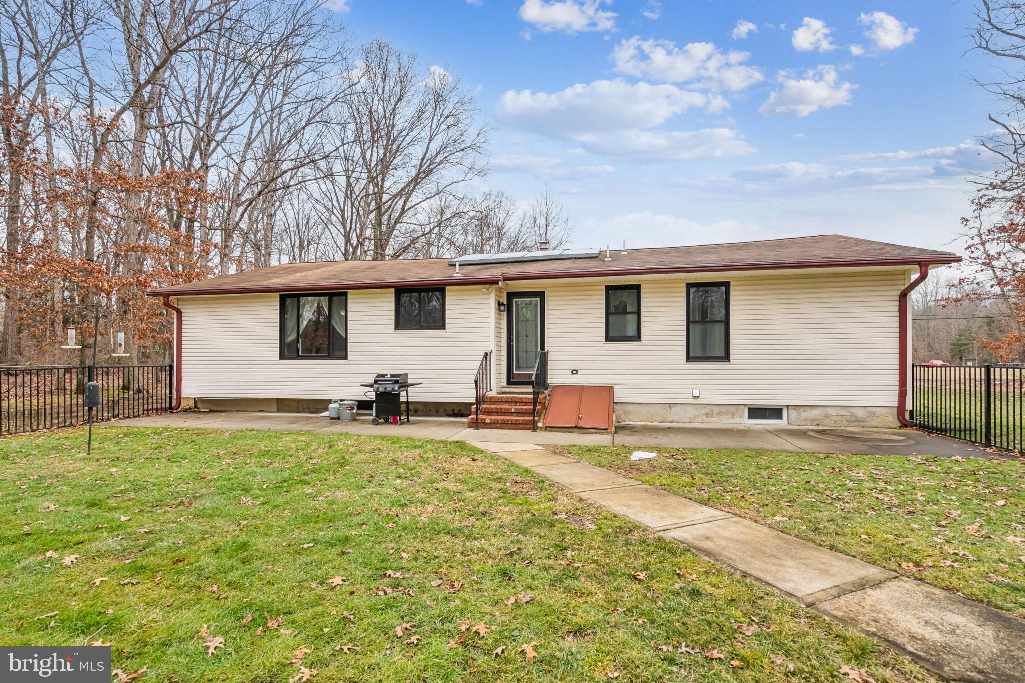 60 Spaulding Drive Monroeville, NJ 08343 - Photo 25 of 26 a view of a house with a backyard and a tree