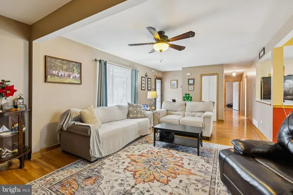 a living room with furniture and a rug