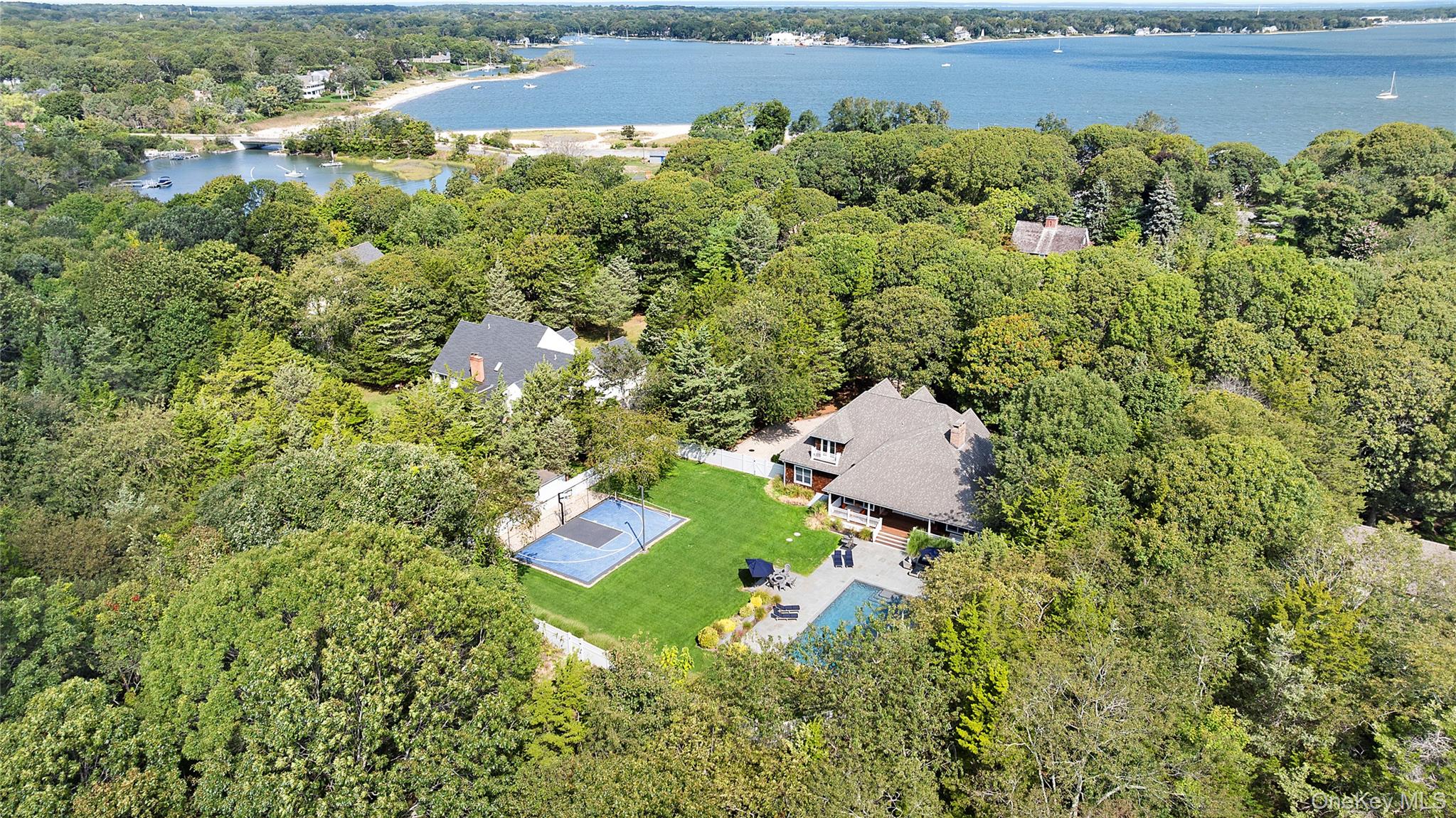3470 North Bayview Road Southold, NY 11971 - Photo 21 of 25 Drone / aerial view of a forest and a large body of water