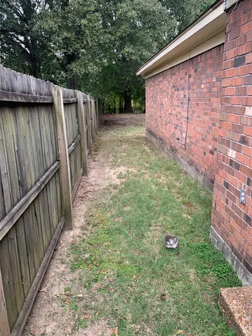 a backyard of a house with lots of green space
