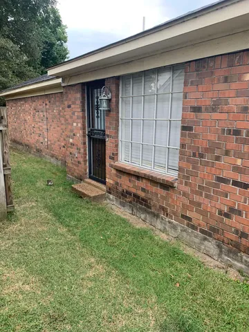 a view of a backyard of the house