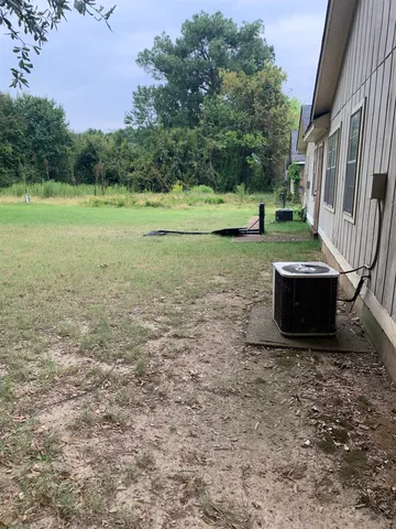 a view of a yard with an trees
