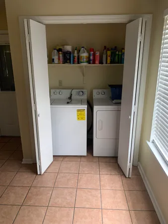 a view of storage and utility room with washer and dryer