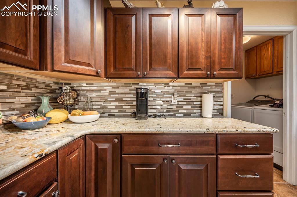 1303 Rancho Del Sol Pueblo, CO 81008 - Photo 11 of 36 a kitchen with granite countertop cabinets sink and stove