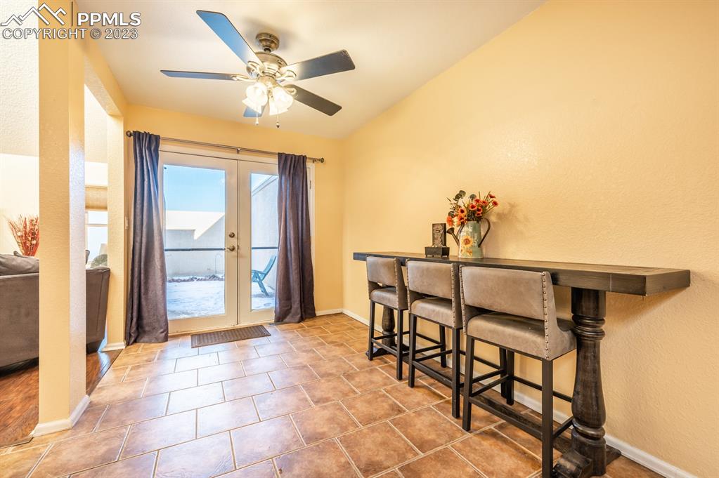 1303 Rancho Del Sol Pueblo, CO 81008 - Photo 16 of 36 a dining room with furniture and a window