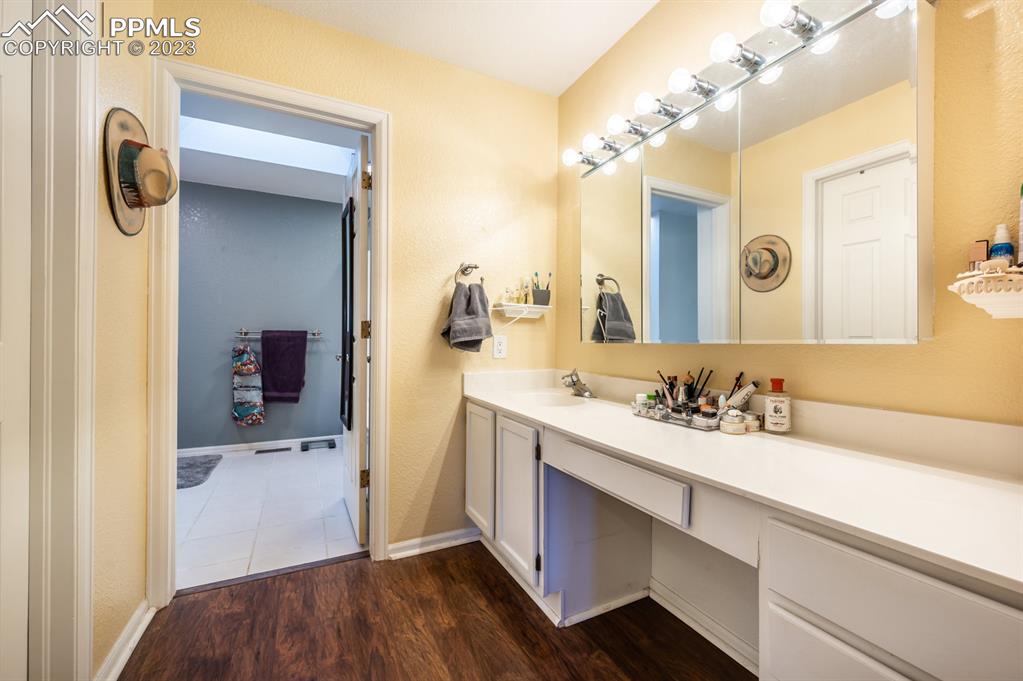 1303 Rancho Del Sol Pueblo, CO 81008 - Photo 28 of 36 a bathroom with a sink a toilet and shower