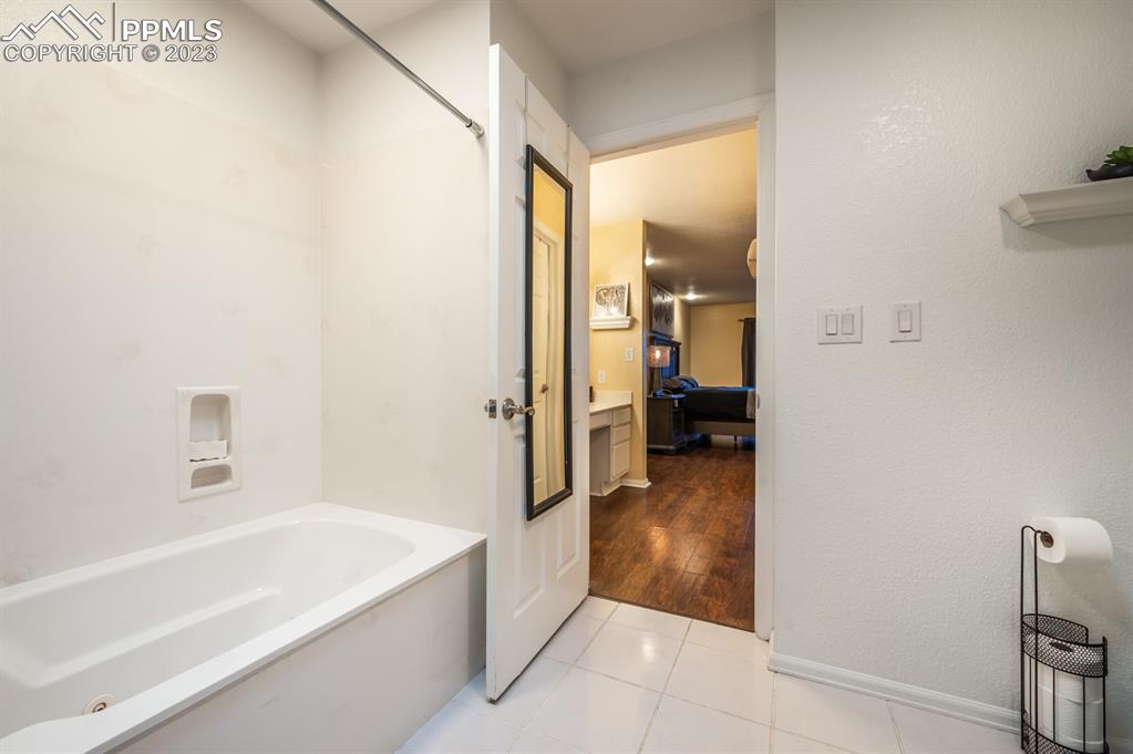 1303 Rancho Del Sol Pueblo, CO 81008 - Photo 31 of 36 a bathroom with a bathtub and a toilet