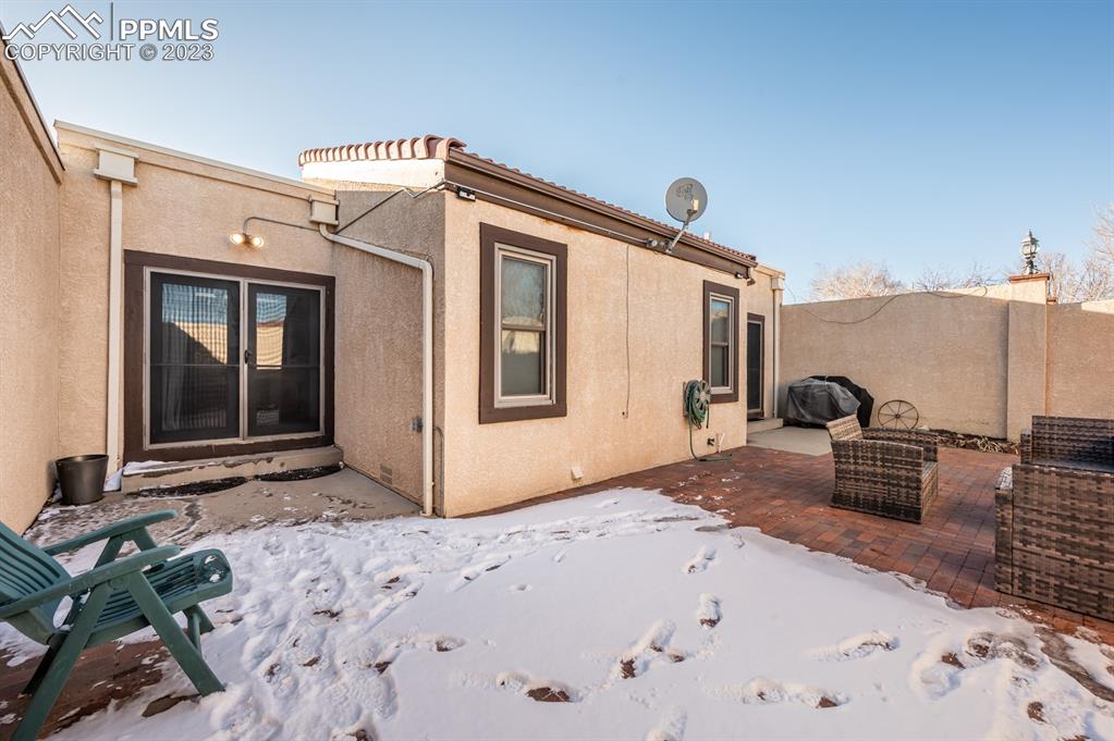 1303 Rancho Del Sol Pueblo, CO 81008 - Photo 34 of 36 a bedroom with a bed and a dresser with wooden floor