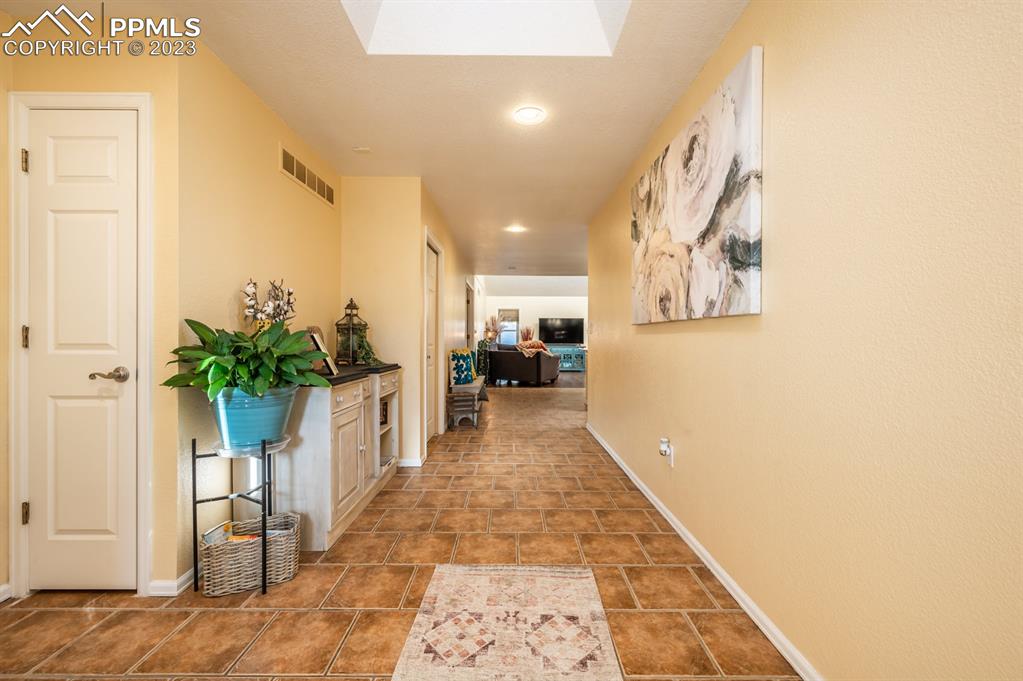 1303 Rancho Del Sol Pueblo, CO 81008 - Photo 6 of 36 a view of entryway and hall with wooden floor