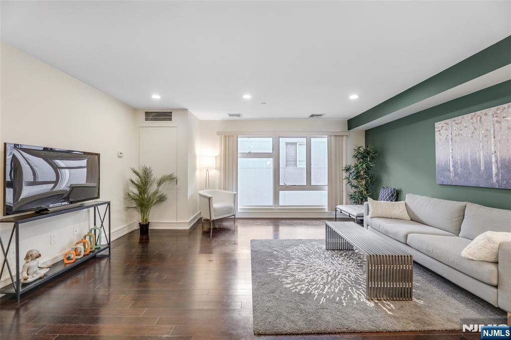 310 Cliff Lane, Unit 3C Cliffside Park, NJ 07010 - Photo 2 of 17 a living room with furniture and a large window