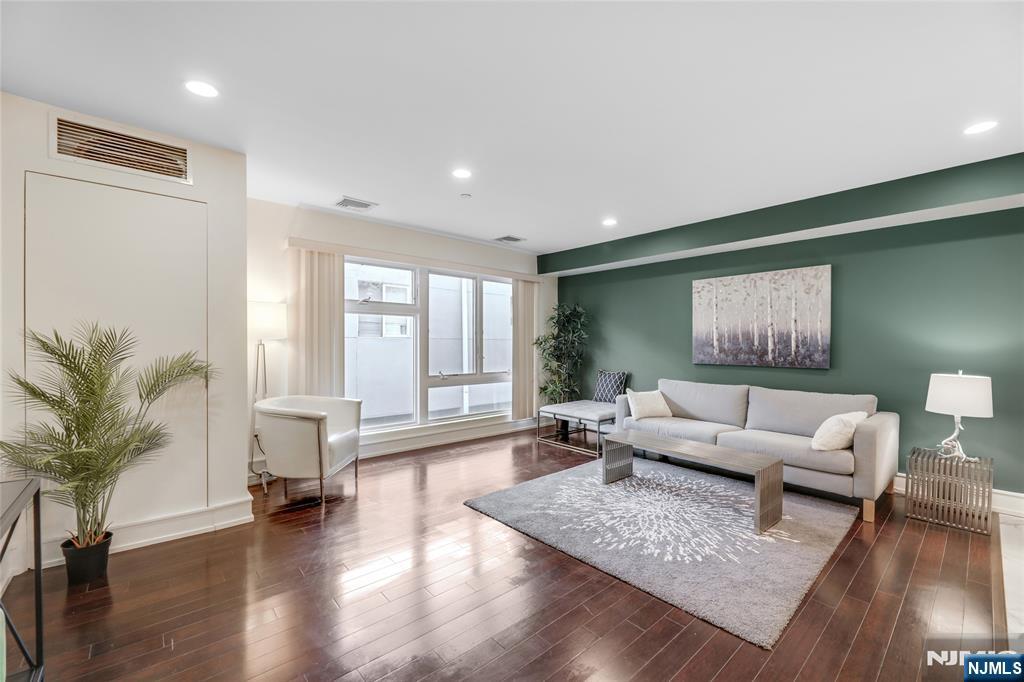 310 Cliff Lane, Unit 3C Cliffside Park, NJ 07010 - Photo 3 of 17 a living room with furniture and a large window