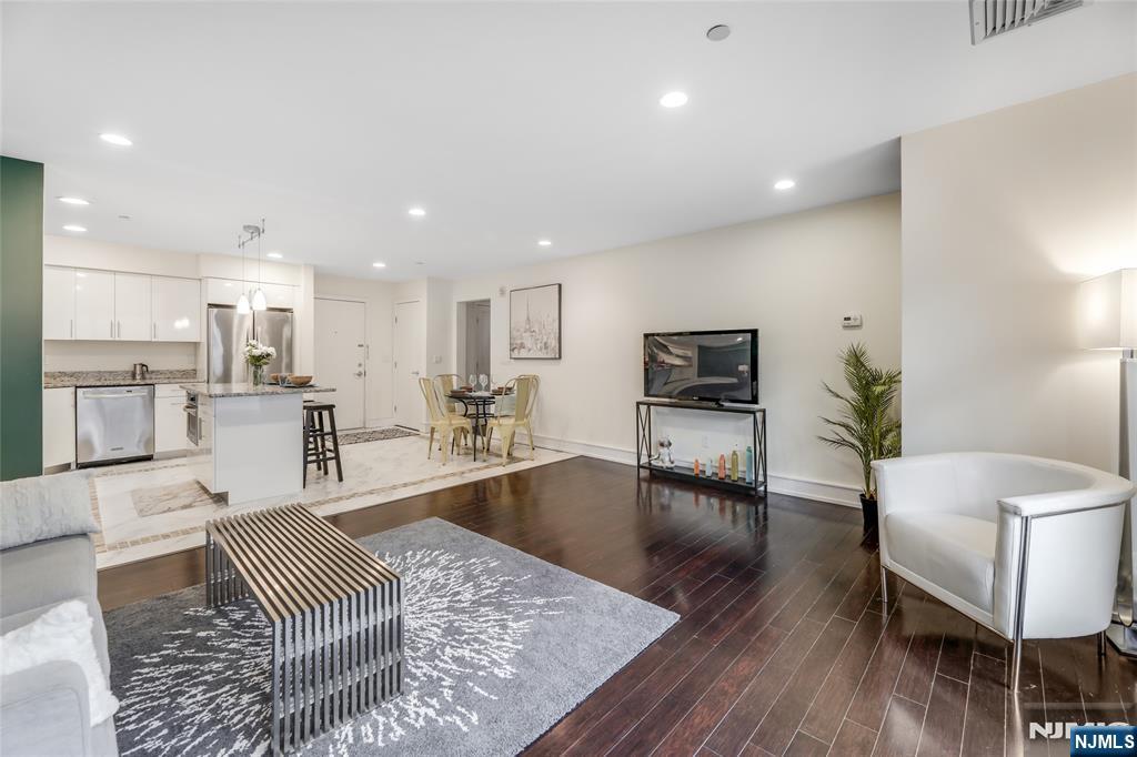 310 Cliff Lane, Unit 3C Cliffside Park, NJ 07010 - Photo 4 of 17 a living room with furniture and a table