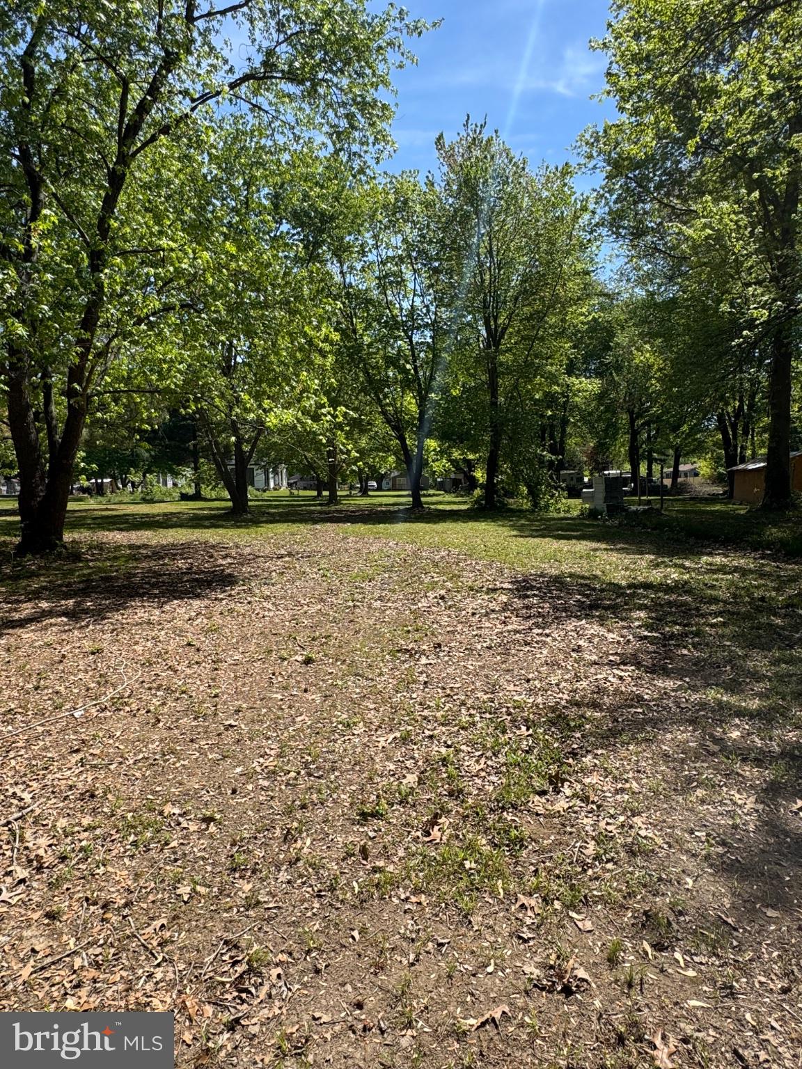 2389 White Oak Road Dover, DE 19901 - Photo 29 of 34 Serene green space under blue skies.