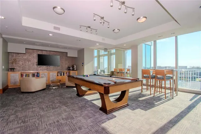 a living room with a table and chairs