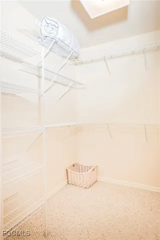 a white bath tub sitting next to a shower