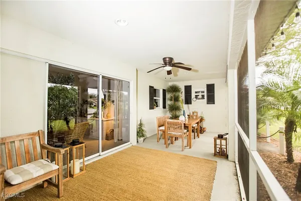 a view of a livingroom with furniture wooden floor and a rug