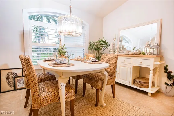 a view of a dining room with furniture and window