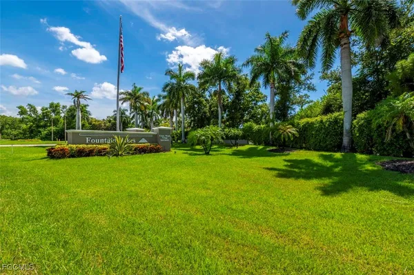 a view of yard with swimming pool and green space