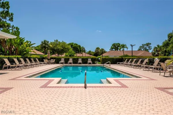 a view of a swimming pool and a yard