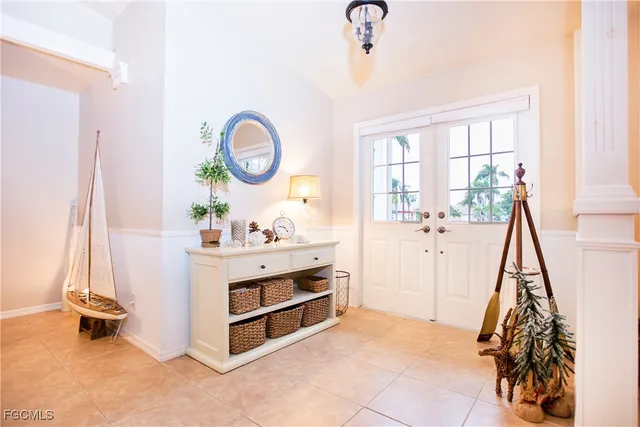 a view of a room with baby crib and a wooden floor