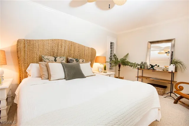 a bedroom with a bed and a night stand