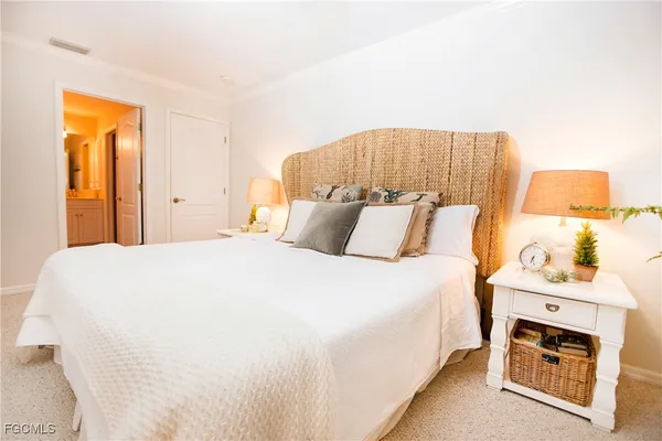 a bedroom with a bed and a fireplace