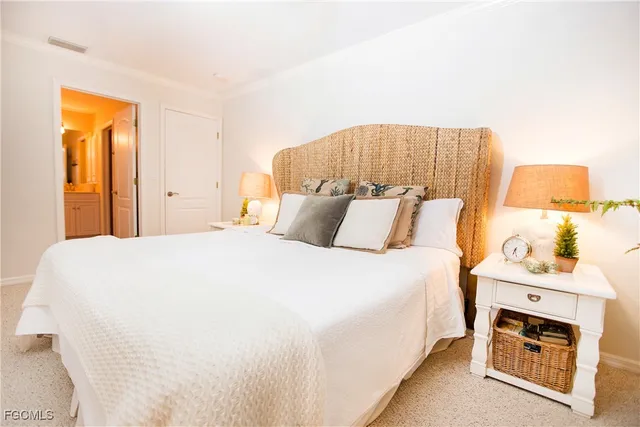 a bedroom with a bed and a fireplace