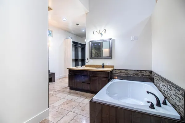 a bathroom with a shower and a sink
