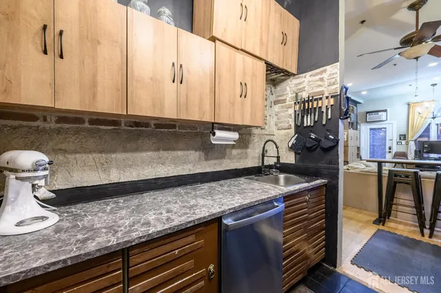 a kitchen with a stove and a refrigerator
