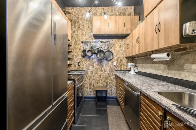 a bathroom with a toilet a sink and a mirror