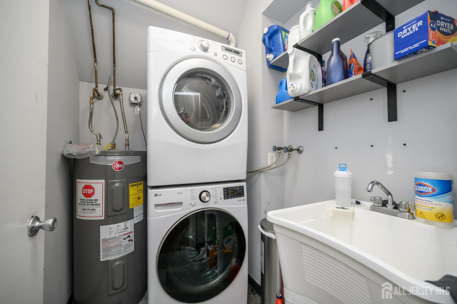 117 Clinton Street, Unit 1F Hoboken, NJ 07030 - Photo 19 of 24 a utility room with dryer and washer