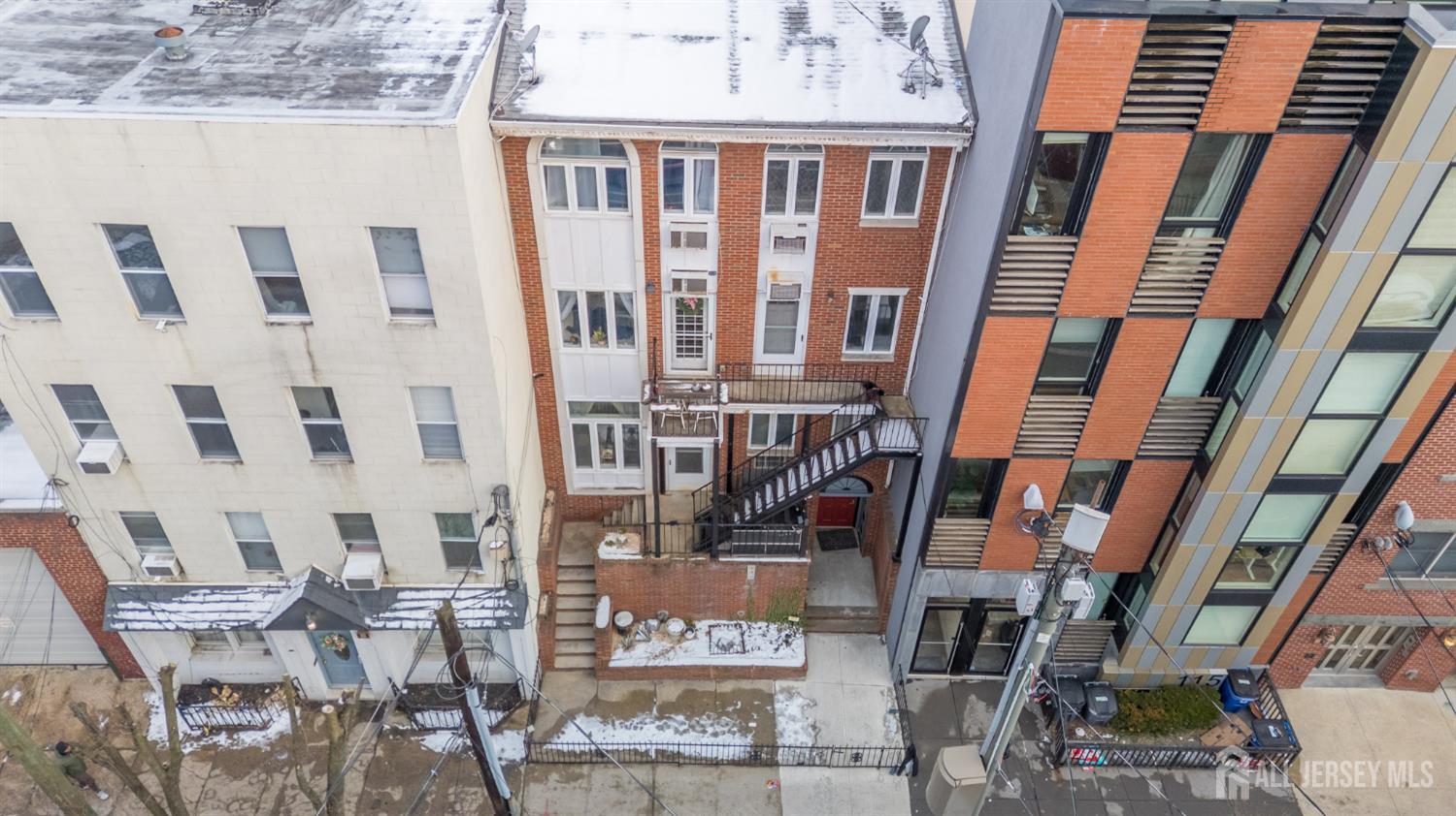 117 Clinton Street, Unit 1F Hoboken, NJ 07030 - Photo 20 of 24 a view of a building with many windows
