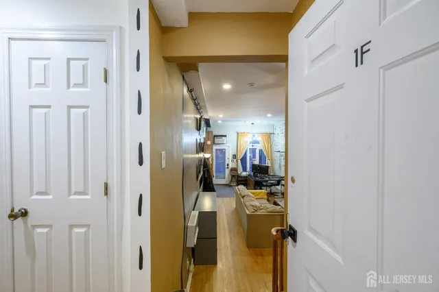 a living room with fireplace furniture and a flat screen tv