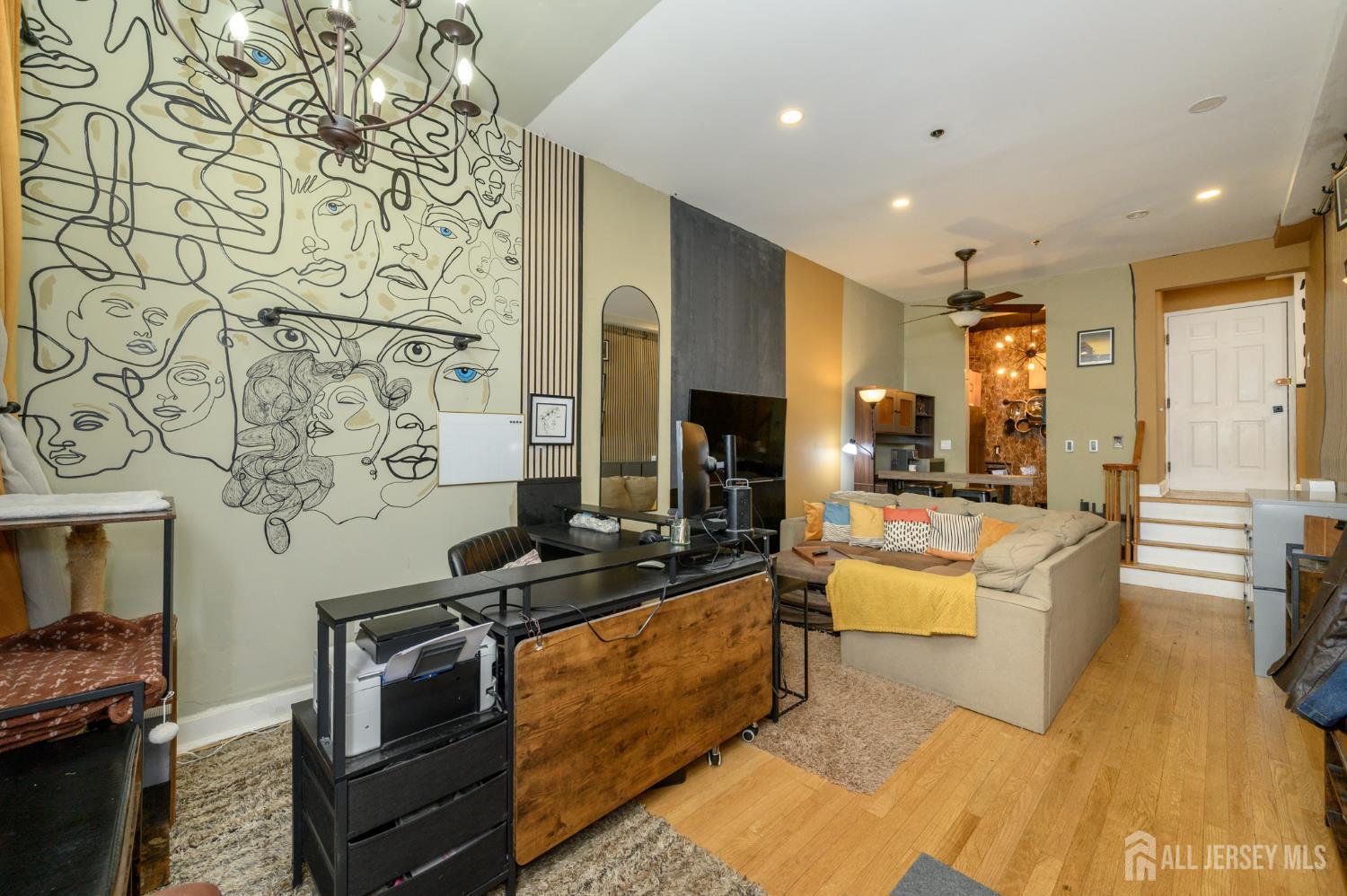 117 Clinton Street, Unit 1F Hoboken, NJ 07030 - Photo 6 of 24 a living room with fireplace furniture and a flat screen tv