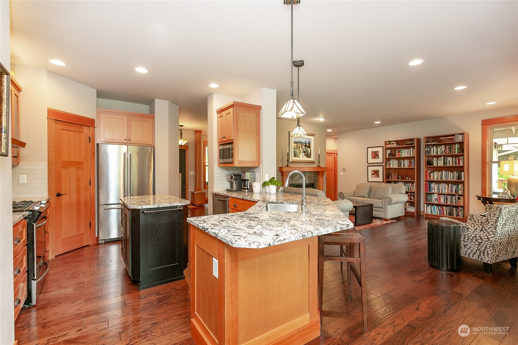 5487 Canvasback Road Blaine, WA 98230 - Photo 16 of 40 a open kitchen with stainless steel appliances granite countertop a refrigerator a stove and a wooden floors