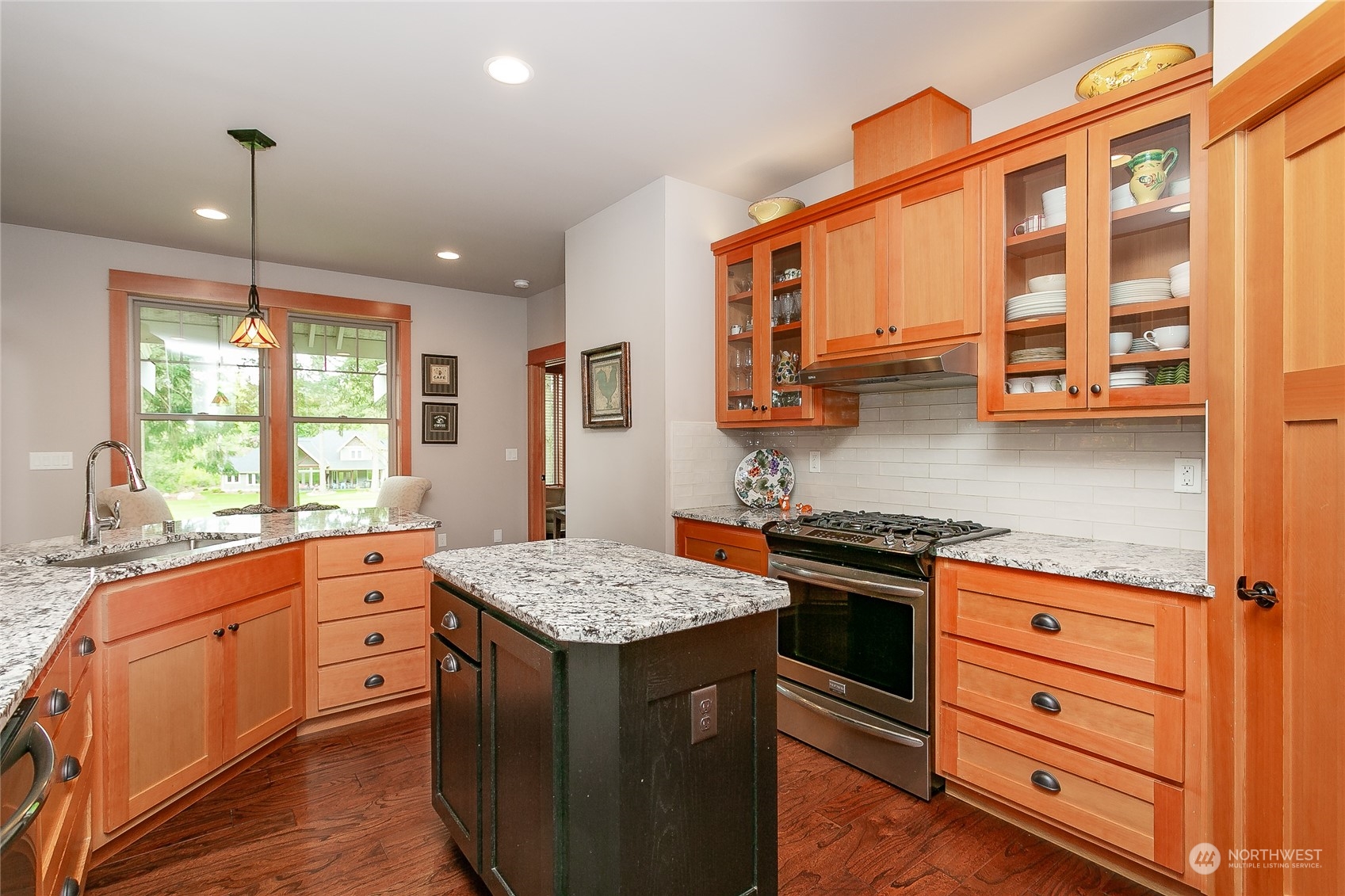 5487 Canvasback Road Blaine, WA 98230 - Photo 19 of 40 a kitchen with stainless steel appliances granite countertop a stove and a sink