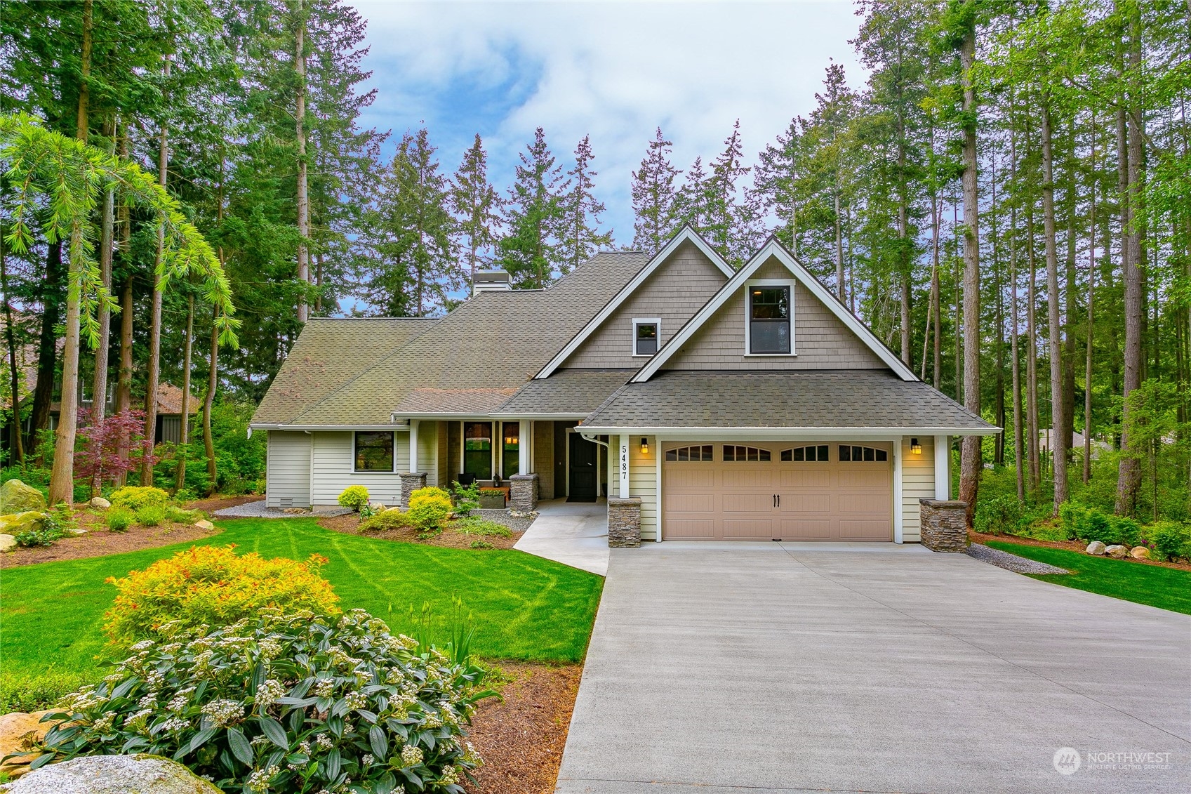 5487 Canvasback Road Blaine, WA 98230 - Photo 2 of 40 a front view of a house with garden