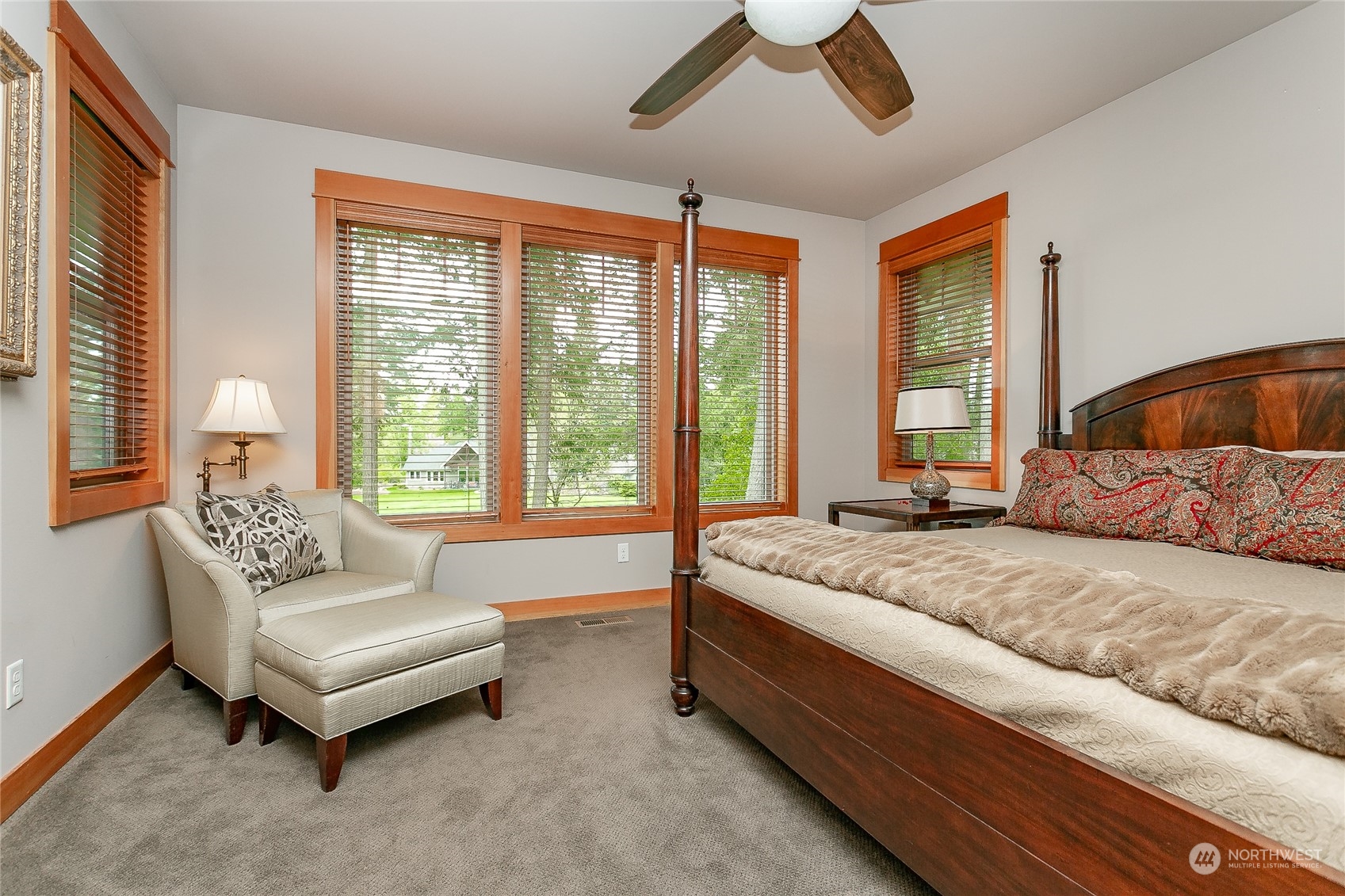 5487 Canvasback Road Blaine, WA 98230 - Photo 23 of 40 a spacious bedroom with a bed and a couch