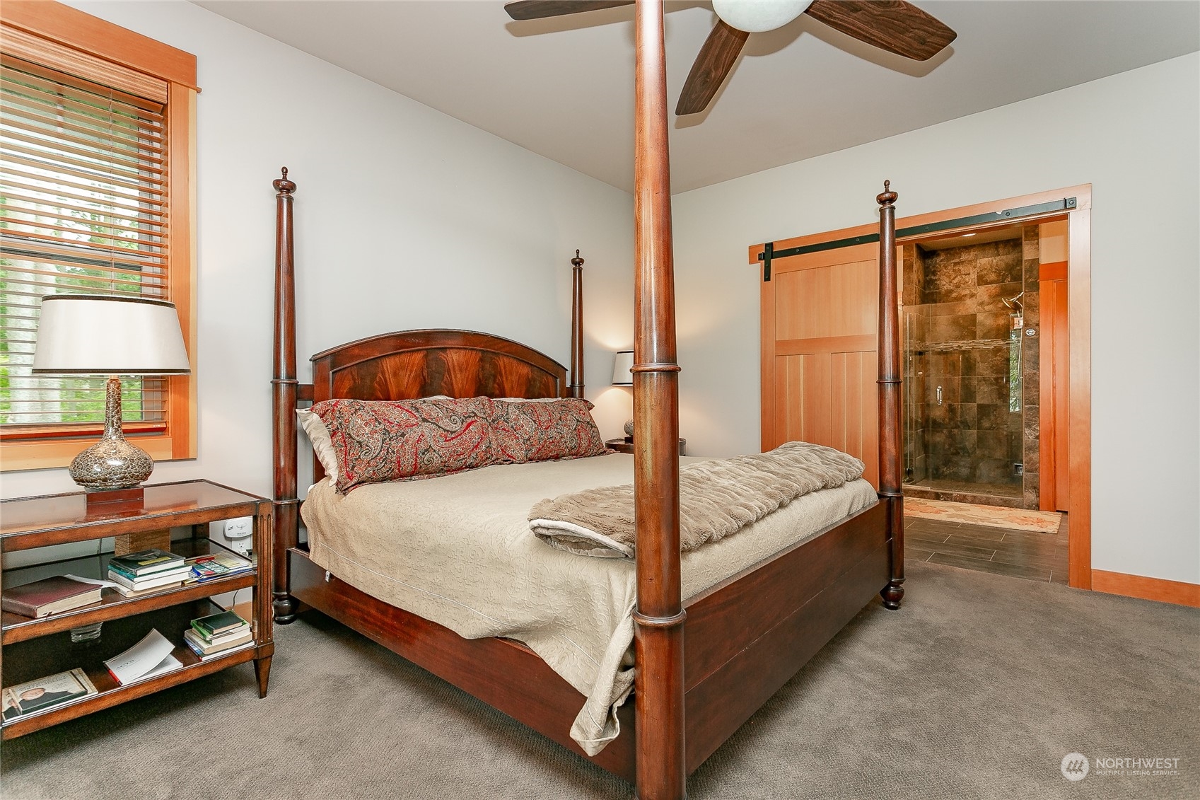 5487 Canvasback Road Blaine, WA 98230 - Photo 24 of 40 a bed sitting in a bedroom next to a window