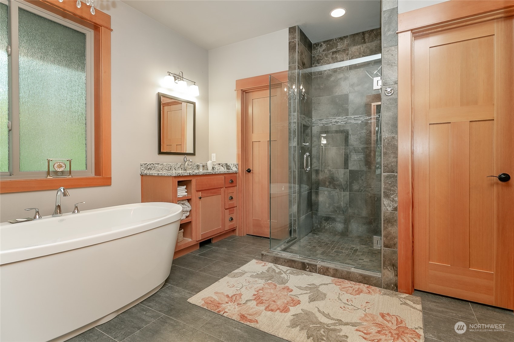 5487 Canvasback Road Blaine, WA 98230 - Photo 25 of 40 a bathroom with a sink mirror and shower