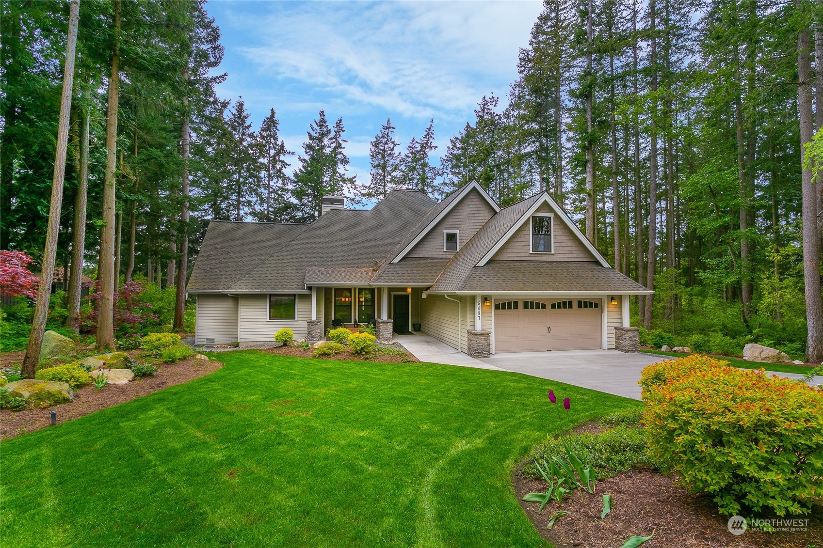 5487 Canvasback Road Blaine, WA 98230 - Photo 3 of 40 a front view of a house with garden
