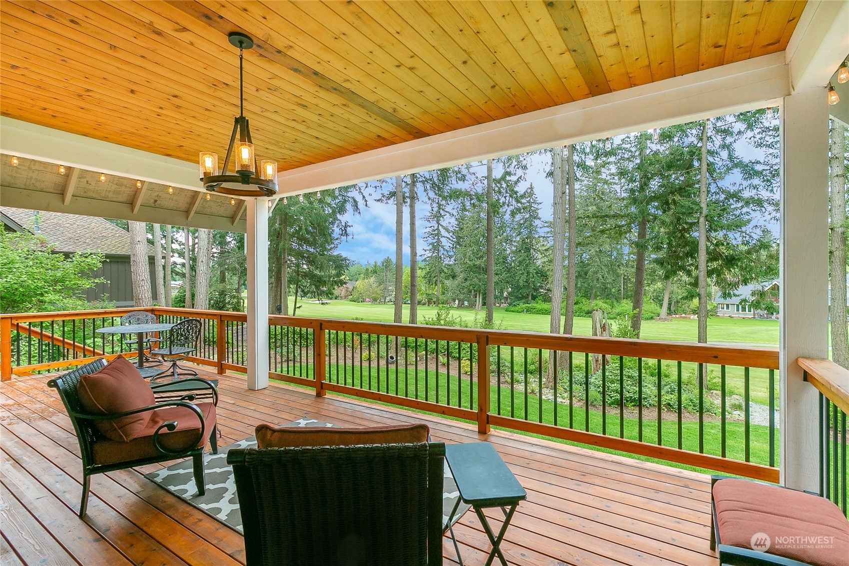 5487 Canvasback Road Blaine, WA 98230 - Photo 38 of 40 a view of a patio with a table chairs and a table