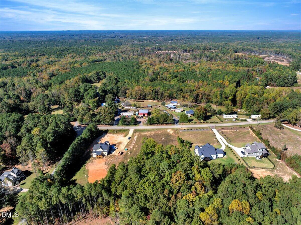 3210 Bruce Garner Road Creedmoor, NC 27522 - Photo 8 of 11 an aerial view of residential houses with outdoor space and trees